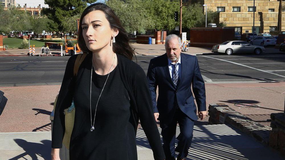 Laney Sweet, left, widow of Daniel Shaver, arrives Oct. 25, 2017, at Maricopa County, Ariz., Superior Court in Phoenix with attorney Mark Geragos, right, for opening statements in the trial of former Mesa, Ariz., Police Officer Philip Brailsford, charged with murder in the fatal 2016 shooting of the unarmed Shaver. On Tuesday, Nov. 22, 2022, Sweet agreed to settle her wrongful death lawsuit. A notice of settlement filed in federal court in Arizona shows that Sweet and her two children will receive $8 million from the city of Mesa. (AP Photo/Ross D. Franklin, File)