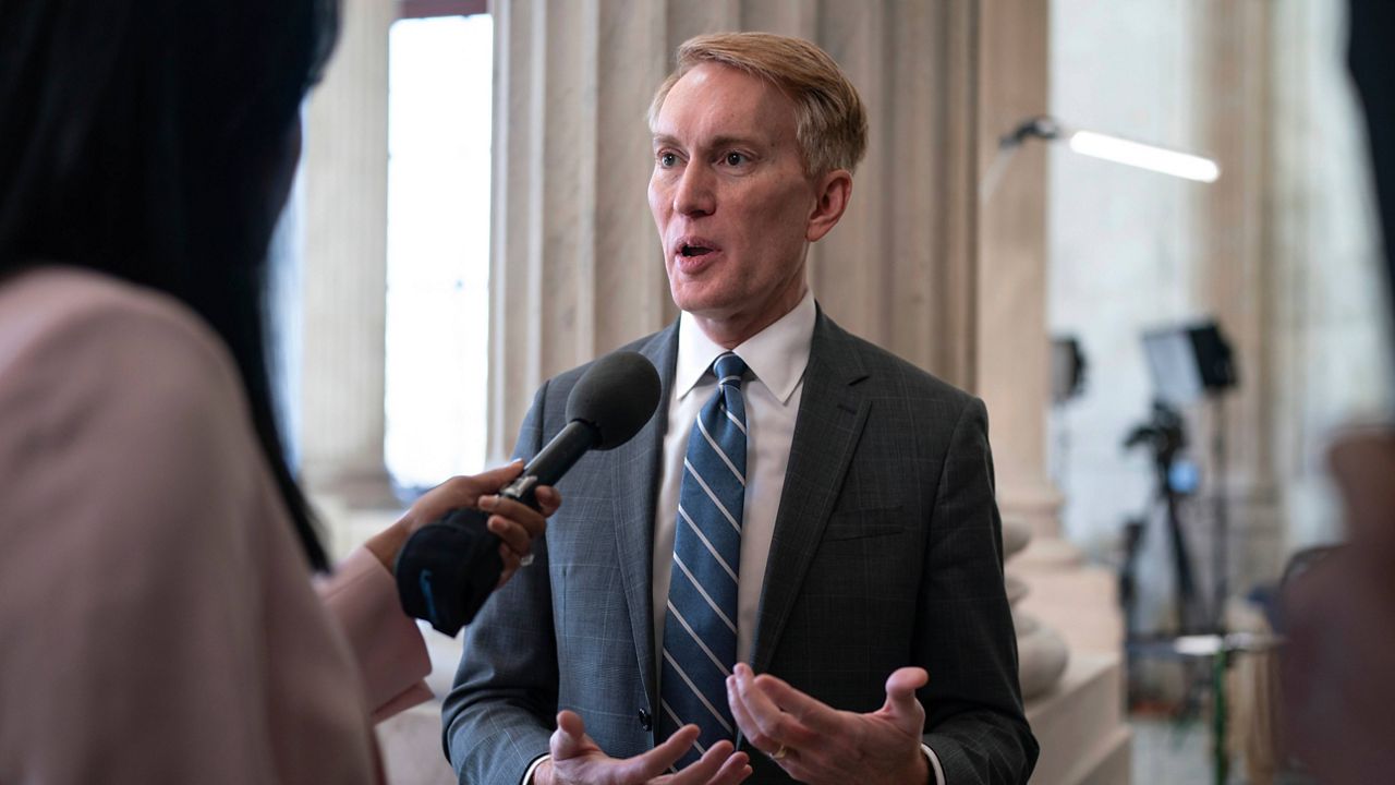 Sen. James Lankford, R-Okla., the lead GOP negotiator on the Senate border and foreign aid package, does a TV news interview on Capitol Hill at the Capitol in Washington, Monday, Feb. 5, 2024. (AP Photo/J. Scott Applewhite)