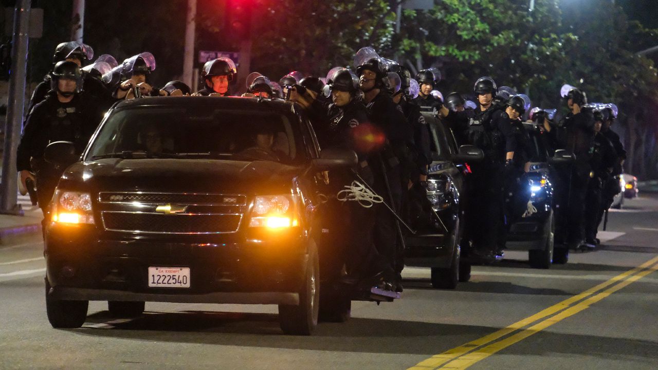 LAPD riot police stand by outside City Hall during a protest of the death of George Floyd, a black man who was in police custody in Minneapolis, in downtown Los Angeles, Wednesday, May 27, 2020. (AP Photo/Ringo H.W. Chiu)