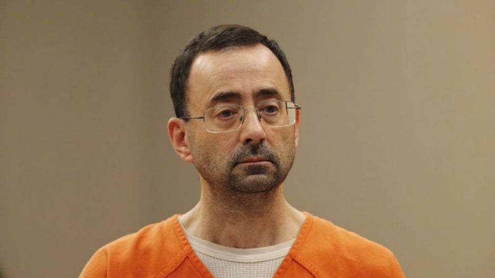 Dr. Larry Nassar, 54, appears in court for a plea hearing in Lansing, Mich., Wednesday, Nov. 22, 2017. Nassar, a sports doctor accused of molesting girls while working for USA Gymnastics and Michigan State University, pleaded guilty to multiple charges of sexual assault and will face at least 25 years in prison. (AP Photo/Paul Sancya)