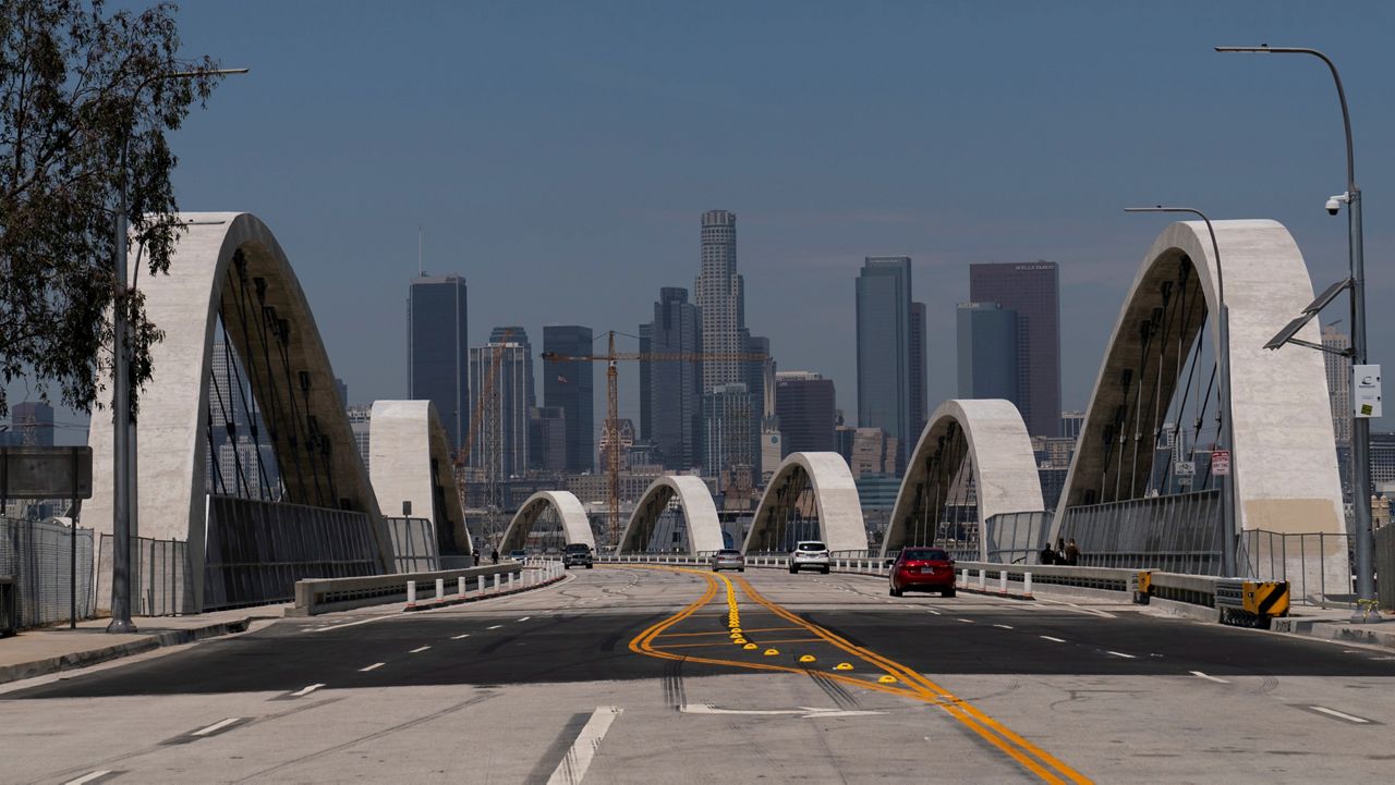 Cars move along the 6th Street Viaduct in Los Angeles, Wednesday, July 27, 2022. (AP Photo/Jae C. Hong)