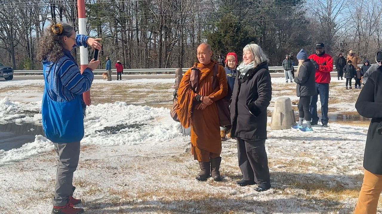 Buddhist monks, supporters battle freezing temperatures after winter storm