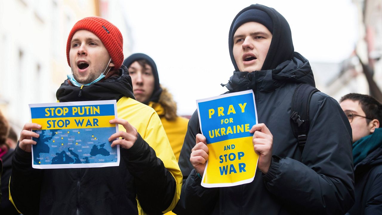 People, including Ukrainians, take part Thursday in a demonstration in support of Ukraine outside the Russian Embassy in Tallinn, Estonia. (AP Photo/Raul Mee)