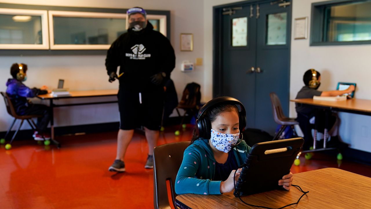 Los Angeles Unified School District students attend online classes at Boys & Girls Club of Hollywood in Los Angeles, Wednesday, Aug. 26, 2020. (AP Photo/Jae C. Hong)
