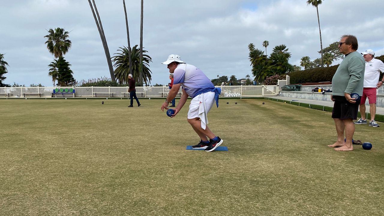Scott Roberts bowls during his regular Sunday session at the Laguna Beach Lawn Bowling Club. (Spectrum News/William D'Urso)
