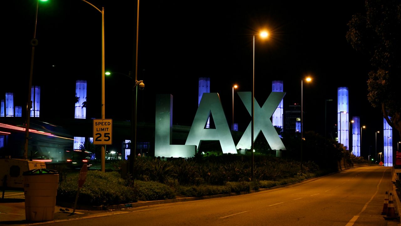 The LAX Gateway Kinetic Light Pylons are seen lit up in blue near Los Angeles International Airport, April 10, 2020. (AP Photo/Mark J. Terrill)