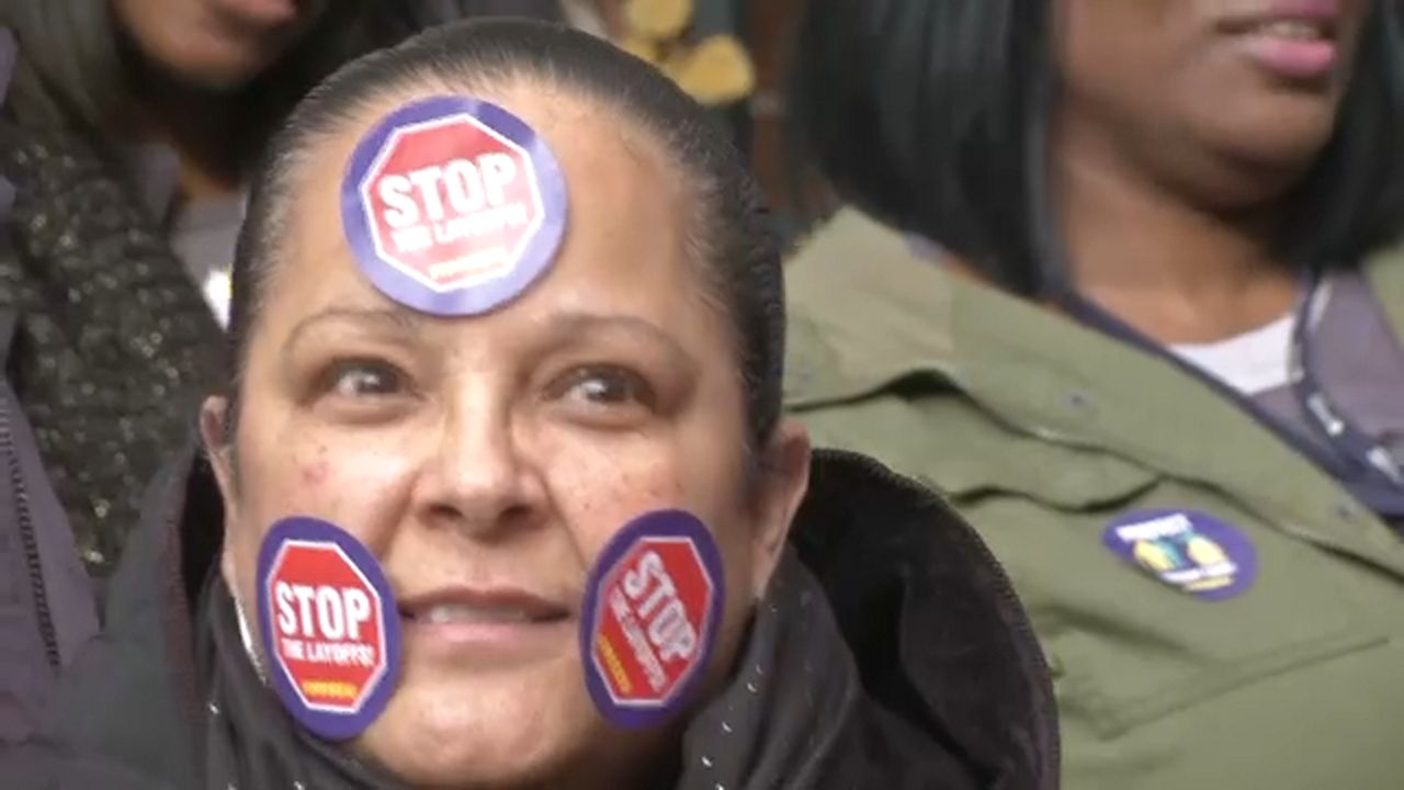 More than 100 health care workers protest layoffs at Maimonides Medical