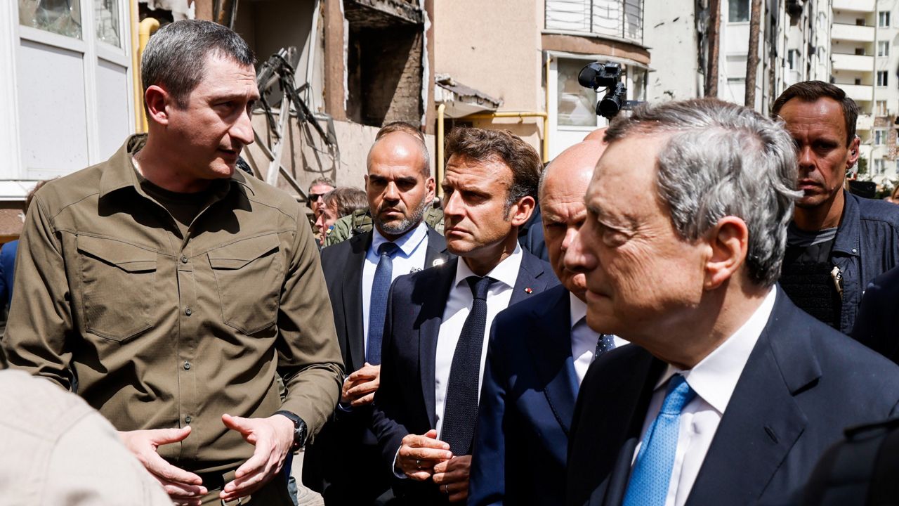 French President Emmanuel Macron, center, German Chancellor Olaf Scholz, partially obscured second right, and Italian Prime Minister Mario Draghi, right, visit Irpin, Ukraine, on Thursday. (Ludovic Marin, Pool via AP)