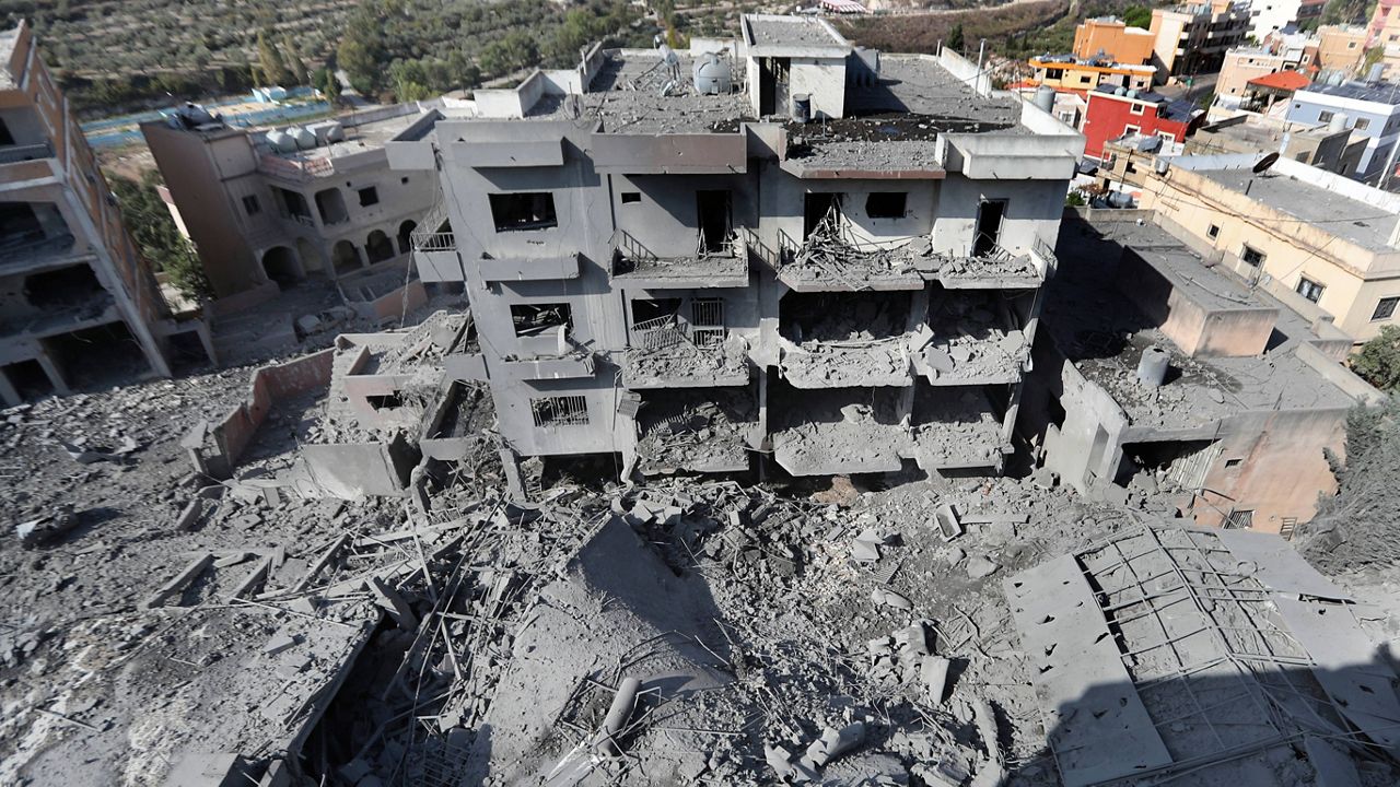 Destroyed buildings that were hit by Israeli airstrikes are seen in Qana village, south Lebanon, Wednesday, Oct. 16, 2024. (AP Photo/Mohammed Zaatari)