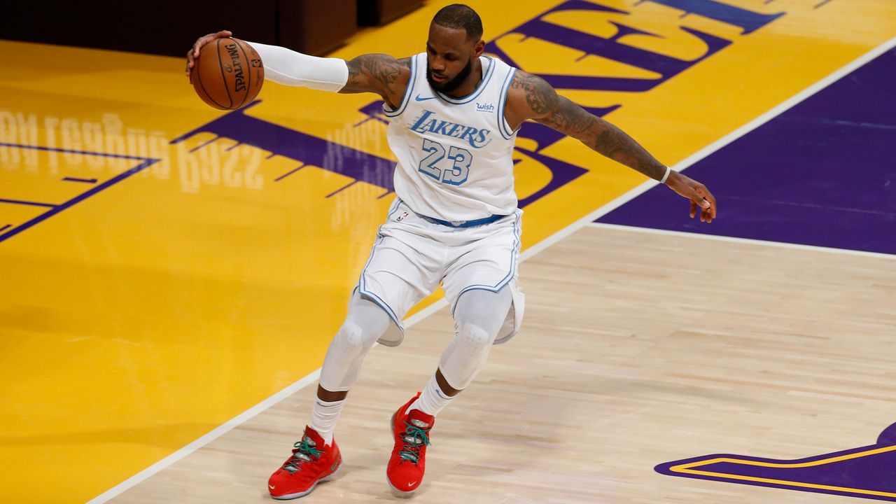 Los Angeles Lakers' LeBron James (23) controls the ball against the Dallas Mavericks during the second half of an NBA basketball game Friday, Dec. 25, 2020, in Los Angeles. The Los Angeles Lakers won 138-115. (AP Photo/Ringo H.W. Chiu)