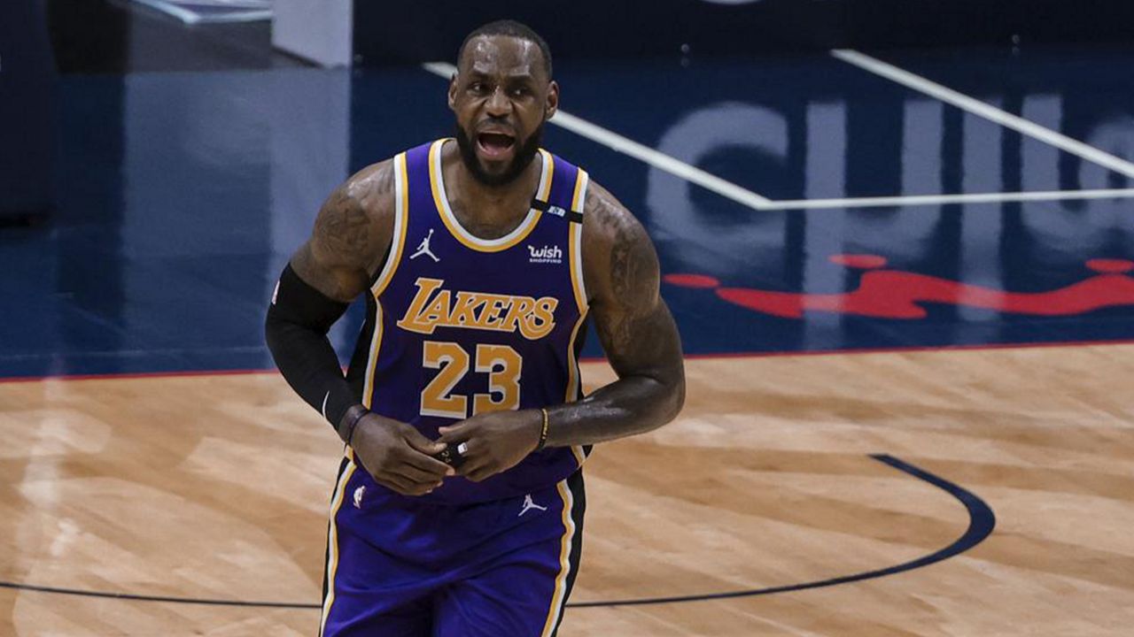 Los Angeles Lakers forward LeBron James (23) celebrates after scoring against the New Orleans Pelicans in the third quarter of an NBA basketball game in New Orleans, Sunday, May 16, 2021. (AP Photo/Derick Hingle)