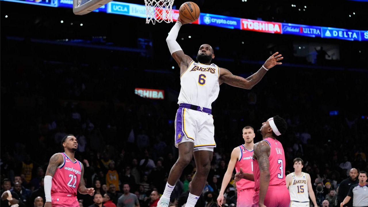 James scores 33 points, Lakers win a close one without Davis