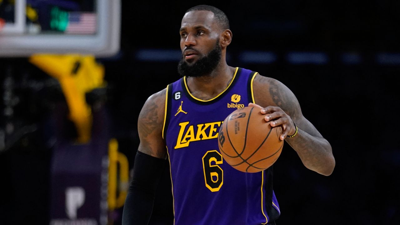 Los Angeles Lakers forward LeBron James dribbles against the Utah Jazz during the second half of an NBA basketball game Friday, Nov. 4, 2022, in Los Angeles. (AP Photo/Marcio Jose Sanchez)