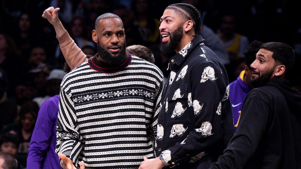 Los Angeles Lakers forward LeBron James, left, and forward Anthony Davis look on from the bench during the second half of an NBA basketball game against the Brooklyn Nets, Monday, Jan. 30, 2023, in New York. (AP Photo/Corey Sipkin)