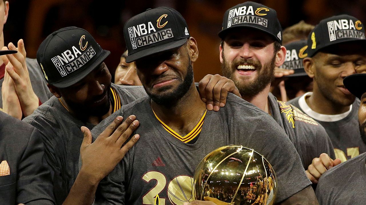 LeBron James, center, celebrates with teammates after Game 7 of basketball's NBA Finals in Oakland, Calif., Sunday, June 19, 2016. (AP Photo/Marcio Jose Sanchez, File)