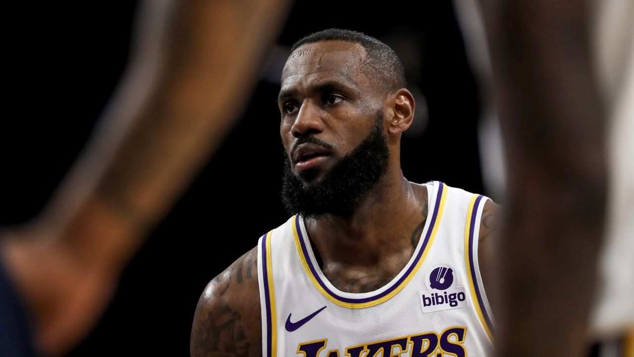 Los Angeles Lakers forward LeBron James (23) concentrates before shooting a free throw during the first half of an NBA basketball game against the Indiana Pacers on Sunday, March 24, 2024, in Los Angeles. (AP Photo/Etienne Laurent)