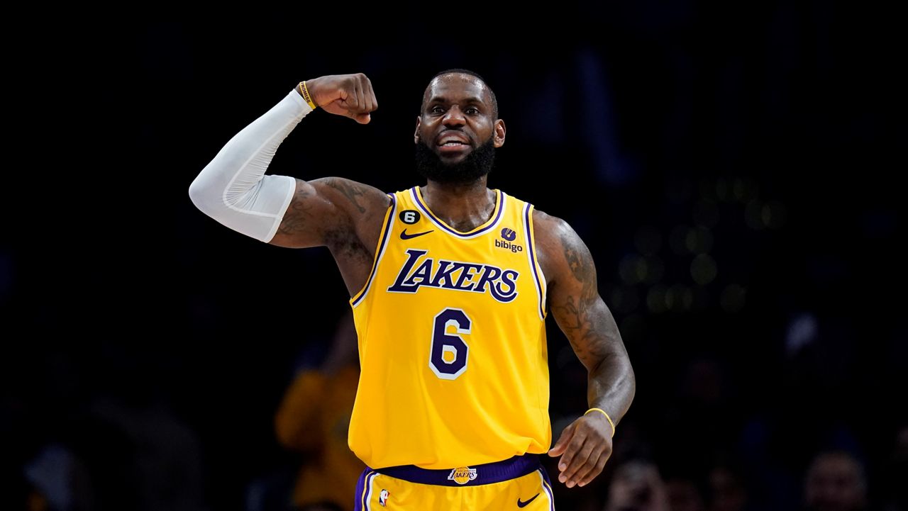 Los Angeles Lakers' LeBron James (6) flexes his arm during the second half of an NBA basketball game against the Houston Rockets Monday, Jan. 16, 2023, in Los Angeles. (AP Photo/Jae C. Hong)