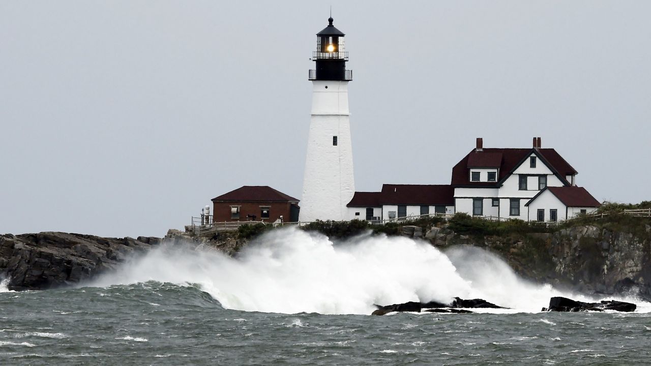 Waves crash against the rocks at Portland Head Light, Saturday, Sept. 15, 2023, in South Portland, Maine. Severe conditions were predicted across parts of Massachusetts and Maine, and hurricane conditions could hit the Canadian provinces of New Brunswick and Nova Scotia, where the storm, Lee, downgraded early Saturday from hurricane to post-tropical cyclone, was expected to make landfall later in the day. (AP Photo/Michael Dwyer)