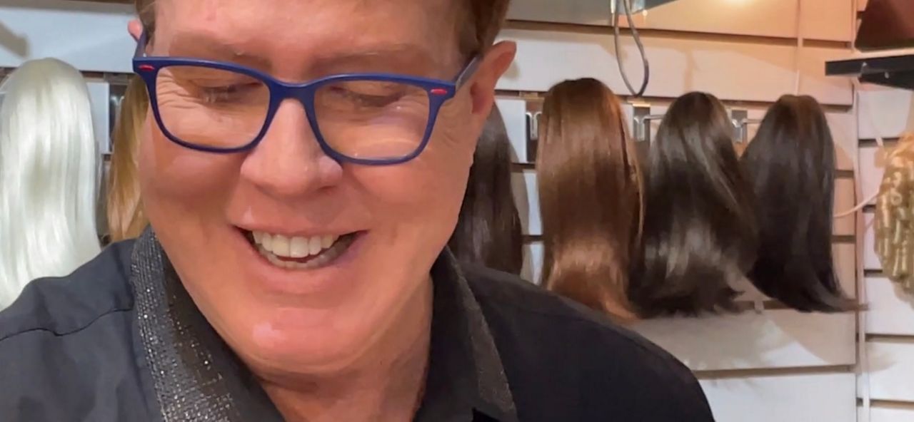 Leigh Shannon enjoys matching breast cancer patients and survivors with wigs at his shop, Ritzy Rags Wigs & More. (Spectrum News/Jeff Allen) 