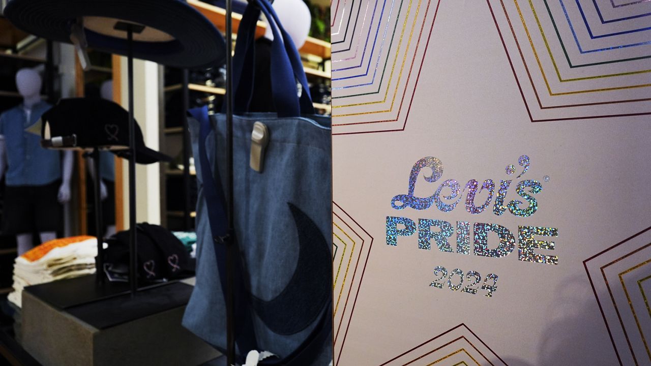 A Levi's Pride 2024 sign is shown at Levi's Store in downtown Chicago, Monday, June 10, 2024. Analysts and advocates say the marketing for Pride month is toned down compared to previous years, and at some chains, there's no trace of Pride at all. (AP Photo/Nam Y. Huh)