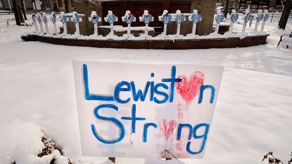 FILE -  Recent snowfall coats crosses at one of several memorials for the victims of last month's mass shooting in Lewiston, Maine, Tuesday, Dec. 5, 2023.  An independent commission investigating the worst mass shooting in Maine's history is about to hear from more family members of the victims of the tragedy. More victims are set to speak Monday, March 4, 2024, at the hearing in Lewiston. (AP Photo/Robert F. Bukaty, File)