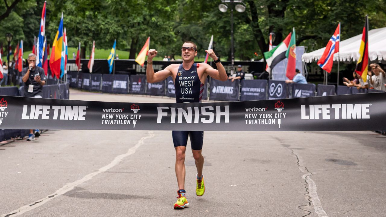 Jason West, 28, of Boulder, CO, takes first place at Life Time's Verizon New York City Triathlon on Sunday, May 11, 2021 in New York.