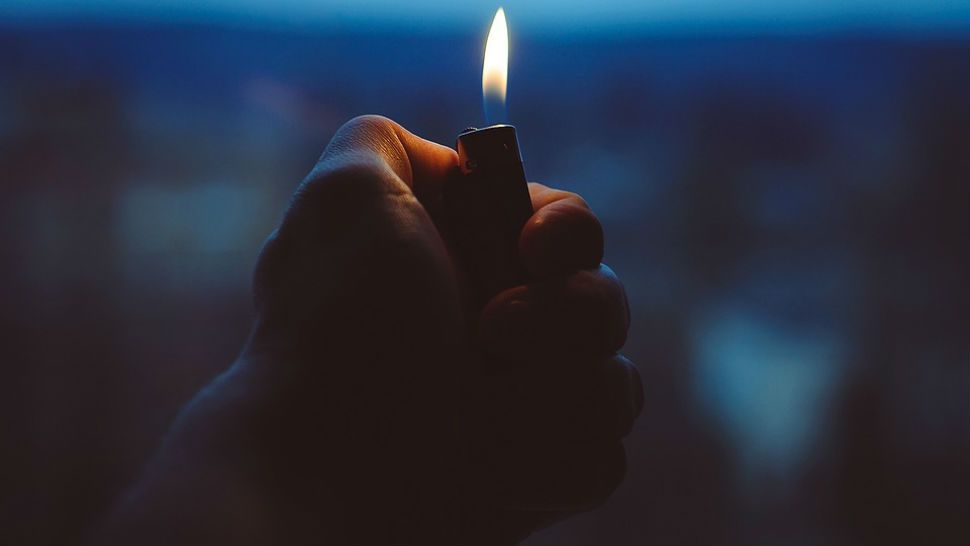 FILE photo of a hand holding a lighter. 