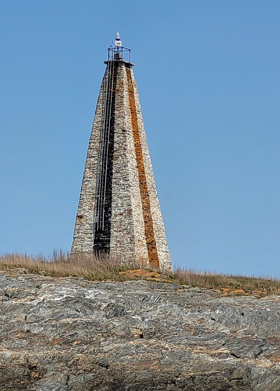 Little Mark Island and Monument stands between Broad Sound and Casco Bay, May 11, 2023, off the coast off Harpswell, Maine. The federal government's annual effort to give away or sell lighthouses that are no longer needed for navigation purposes includes 10 lighthouses this year. (Barbara Salfity/General Services Administration via AP)