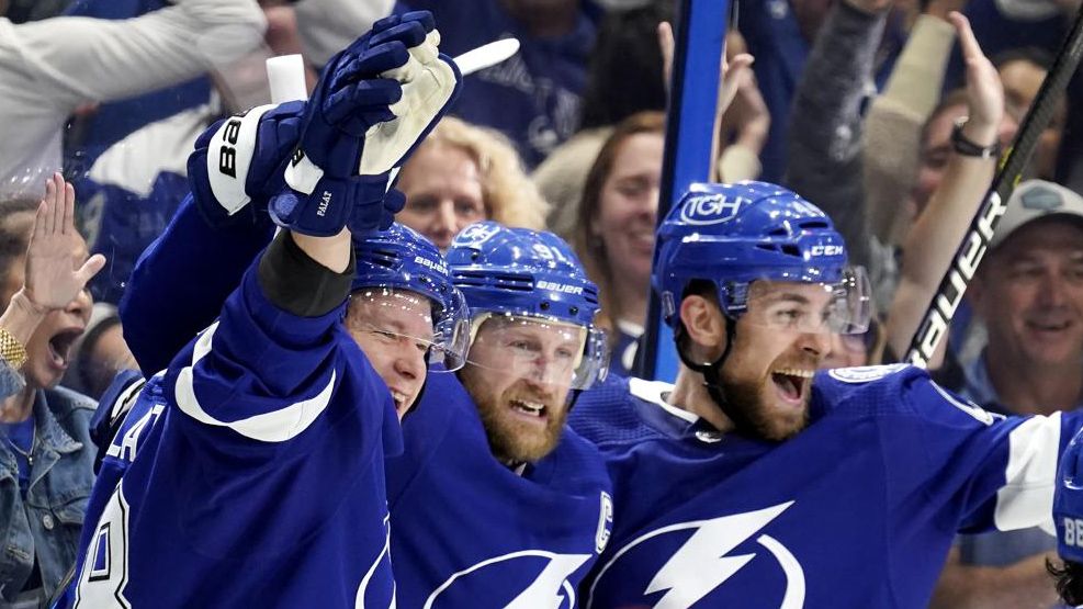 Tampa Bay Lightning center Steven Stamkos, center, celebrates his goal against the New York Rangers with Jan Rutta, right and Tampa Bay Lightning left wing Ondrej Palat, left, during the second period in Game 6 of the NHL hockey Stanley Cup playoffs Eastern Conference finals, Saturday, June 11, 2022, in Tampa, Fla. (AP Photo/Chris O'Meara)