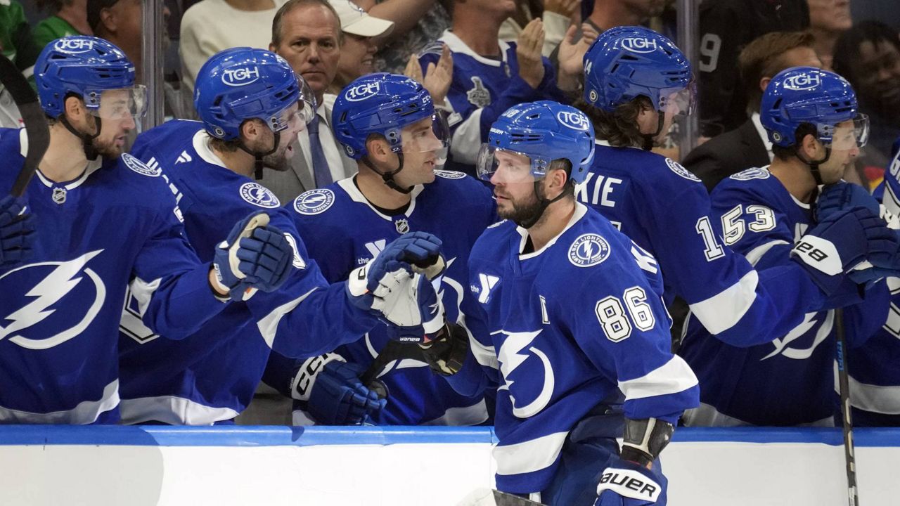 Tampa Bay Lightning right wing Nikita Kucherov (86) celebrates with the bench after his goal against the Florida Panthers during the third period of an NHL preseason hockey game Wednesday, Oct. 2, 2024, in Tampa, Fla. (AP Photo/Chris O'Meara)