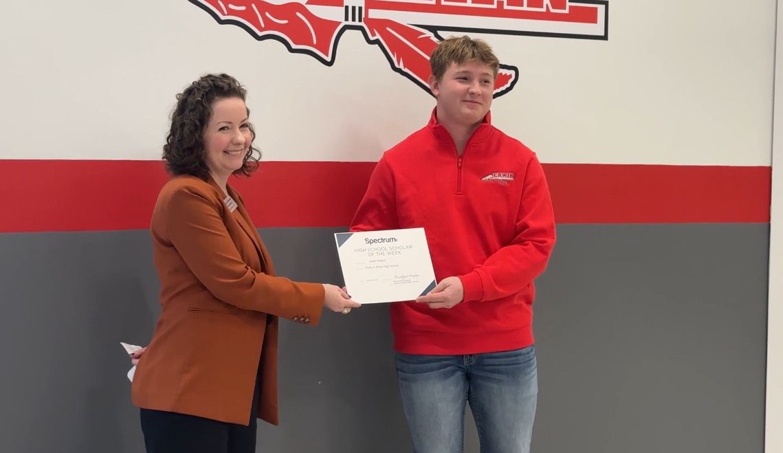 State Rep. Lindsey Prather presents the Spectrum News North Carolina High School Scholar award to Judah Dayton. (Spectrum News 1)