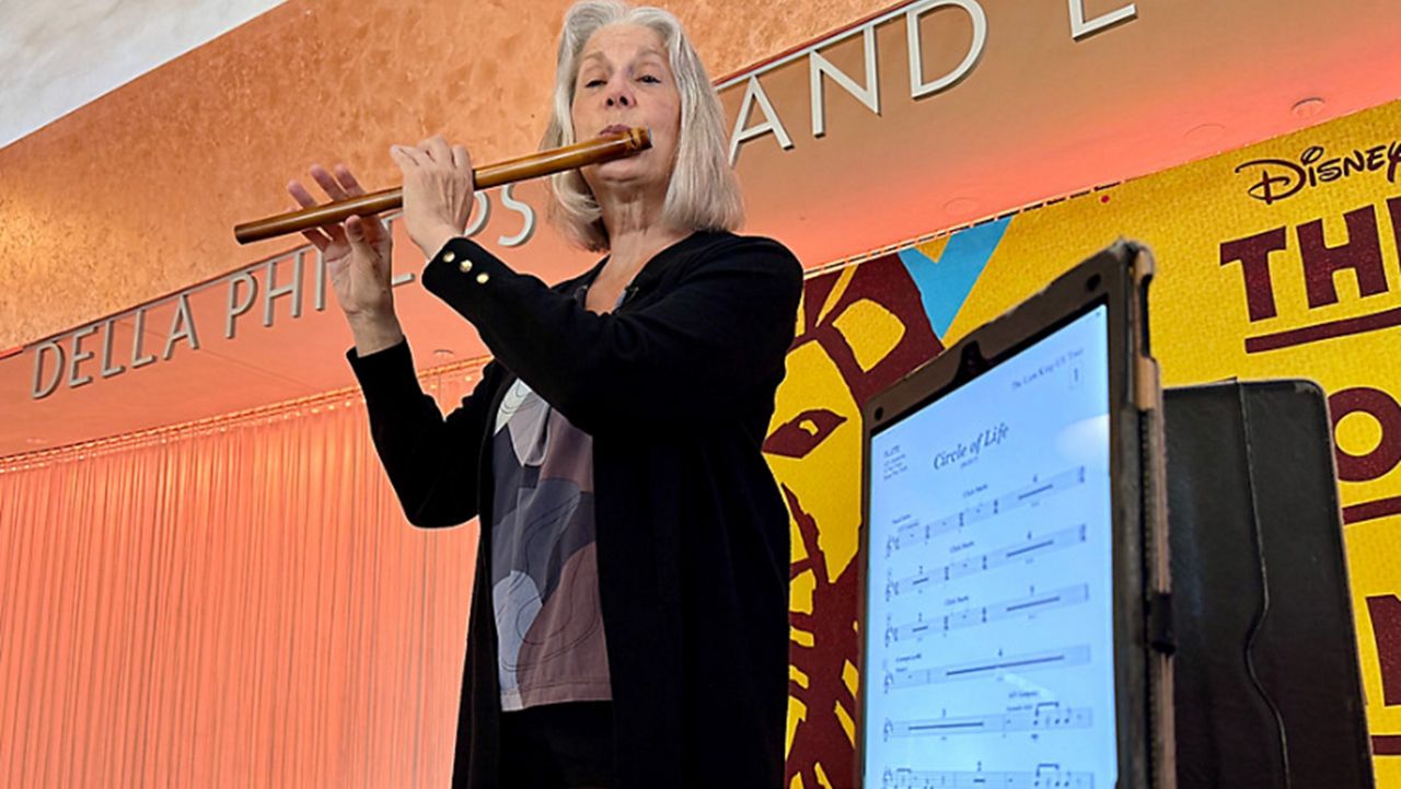 Darlene Drew, sole flutist for 'The Lion King' production currently in Orlando, plays 13 flutes during the Broadway show. (Spectrum News/Allison Walker)