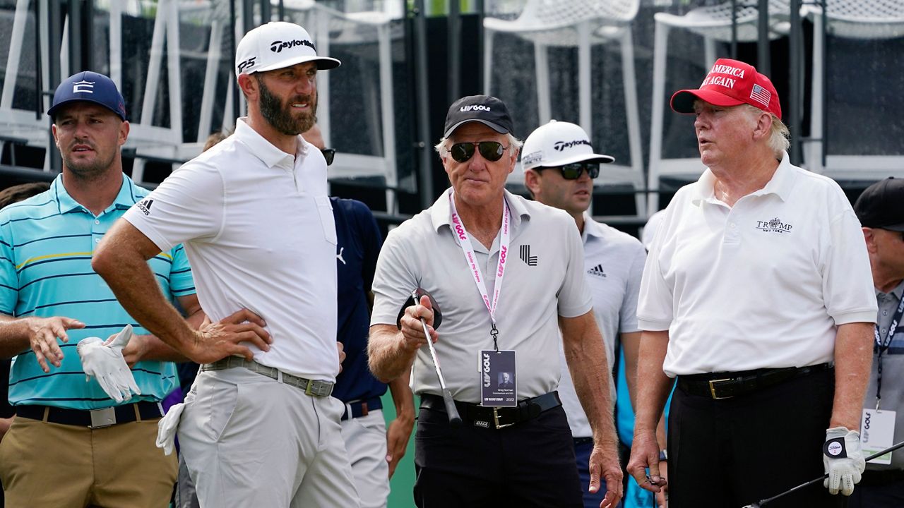 Golfers Bryson DeChambeau, Dustin Johnson, LIV Golf CEO Greg Norman and former President Donald Trump, left to right, look on during the pro-am round of the Bedminster Invitational LIV Golf tournament in Bedminster, NJ., Thursday, July 28, 2022. (AP Photo/Seth Wenig)