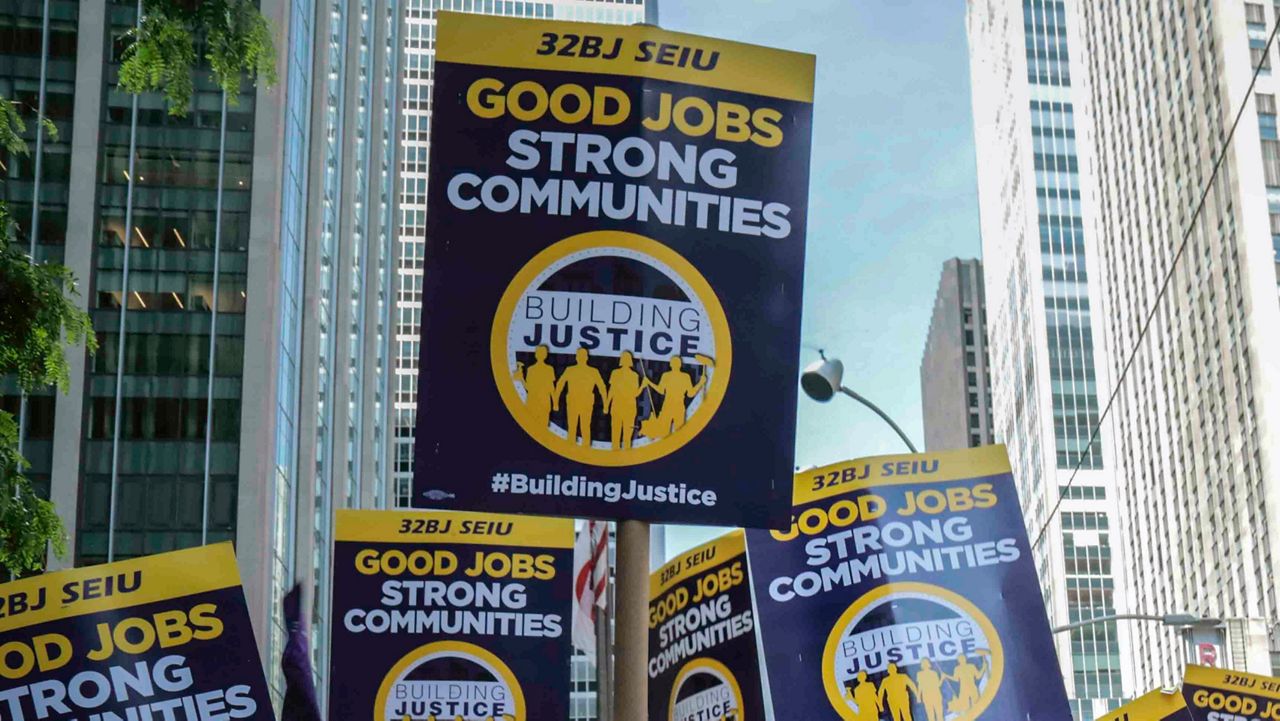 Local 32BJ signs are pictured.