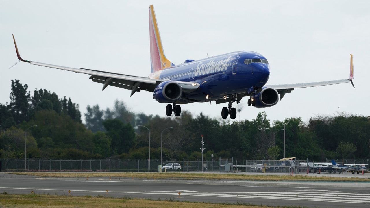 A Southwest Airlines plane lands at Long Beach Airport. (AP Photo/Ashley Landis)