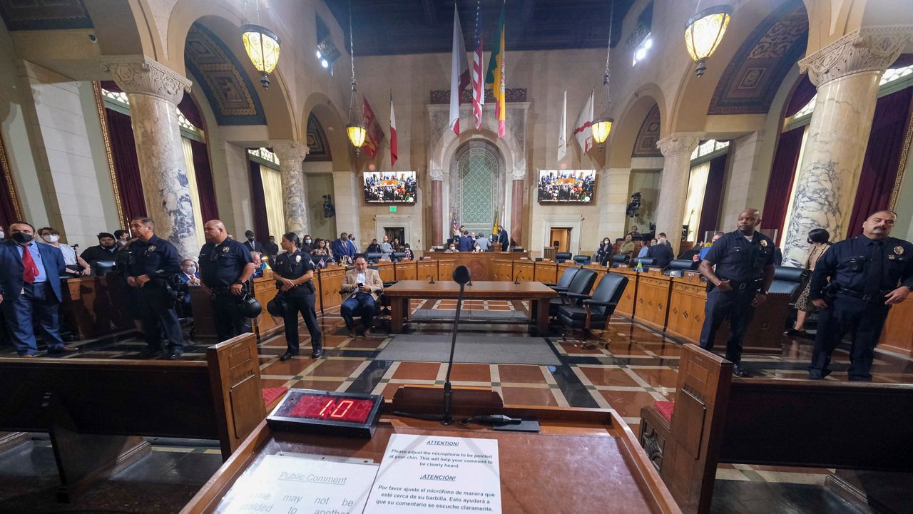 Los Angeles City Council members wait to start the Los Angeles City Council meeting Wednesday, Oct. 12, 2022 in Los Angeles. (AP Photo/Ringo H.W. Chiu)