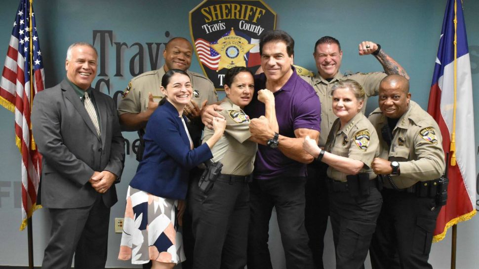 Actor Lou Ferrigno, right of center, in purple, poses with Travis County Sheriff's Office staff in this image from Sept. 20, 2018. (Travis County Sheriff's Office/Twitter)