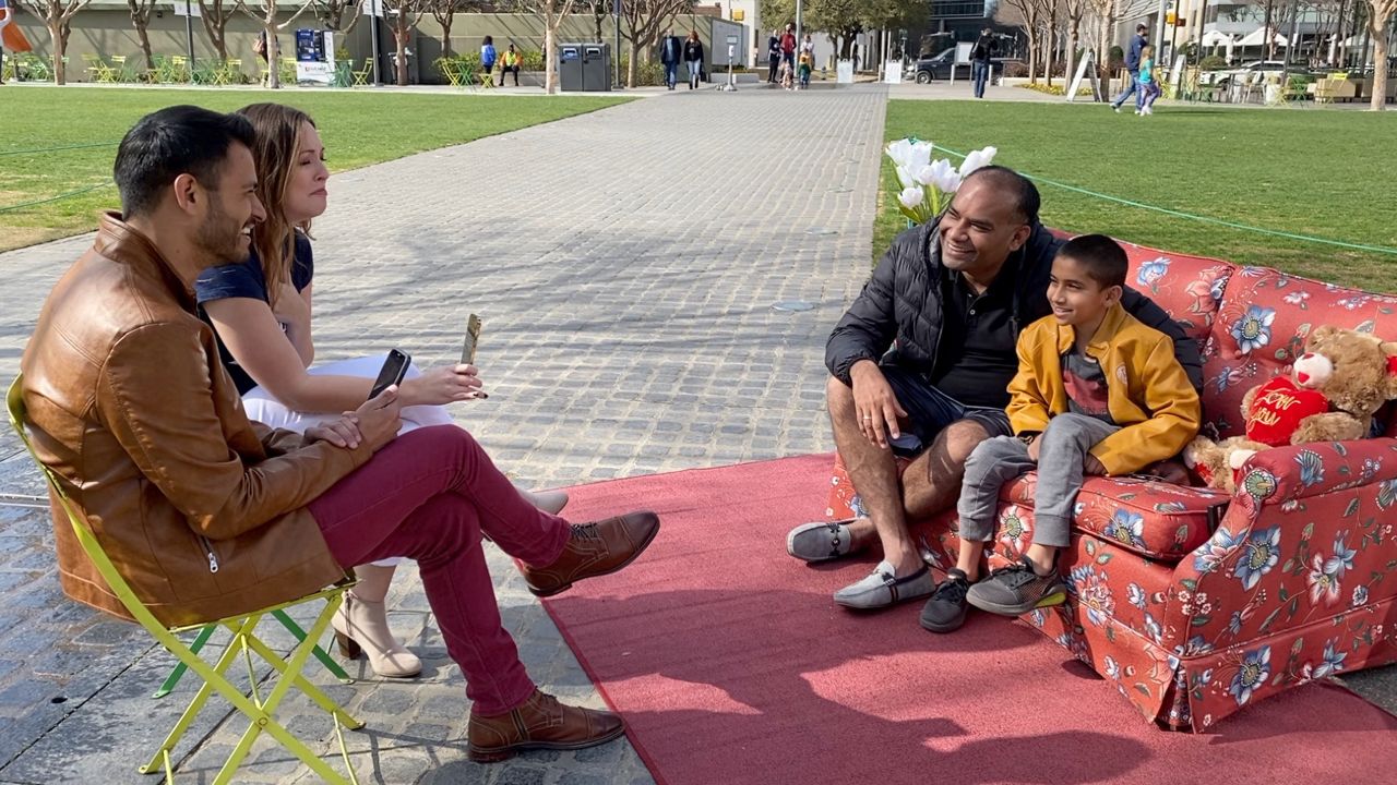 Spectrum News 1 reporters Lupe Zapata and Stacy Rickard at the set of their news story, Tell Me A Story, filmed in Klyde Warren Park in downtown Dallas. (Lupe Zapata/Spectrum News 1)