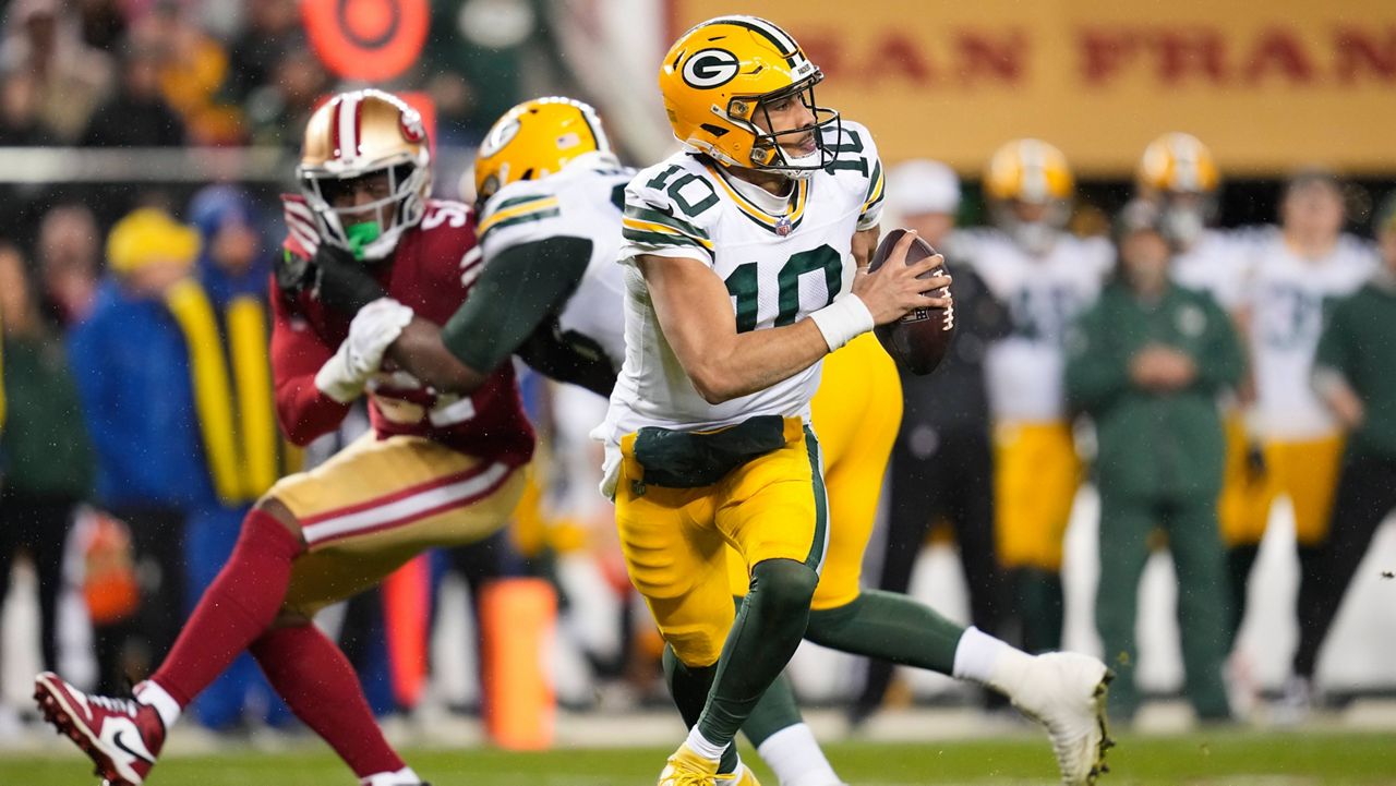 Green Bay Packers quarterback Jordan Love (10) looks for a receiver during an NFL football game against the San Francisco 49ers 