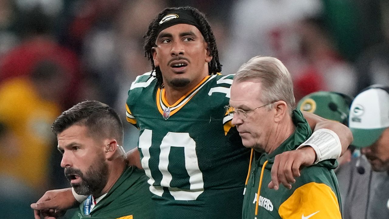 Green Bay Packers quarterback Jordan Love (10) in helped off the field after getting hurt during the second half of an NFL football game against the Philadelphia Eagles, Saturday, Sept. 7, 2024, at the Neo Quimica Arena in Sao Paulo. (AP Photo/Doug Benc)