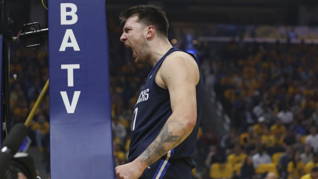 Dallas Mavericks guard Luka Doncic reacts against the Golden State Warriors during the first half of Game 2 of the NBA basketball playoffs Western Conference finals in San Francisco, Friday, May 20, 2022. (AP Photo/Jed Jacobsohn)