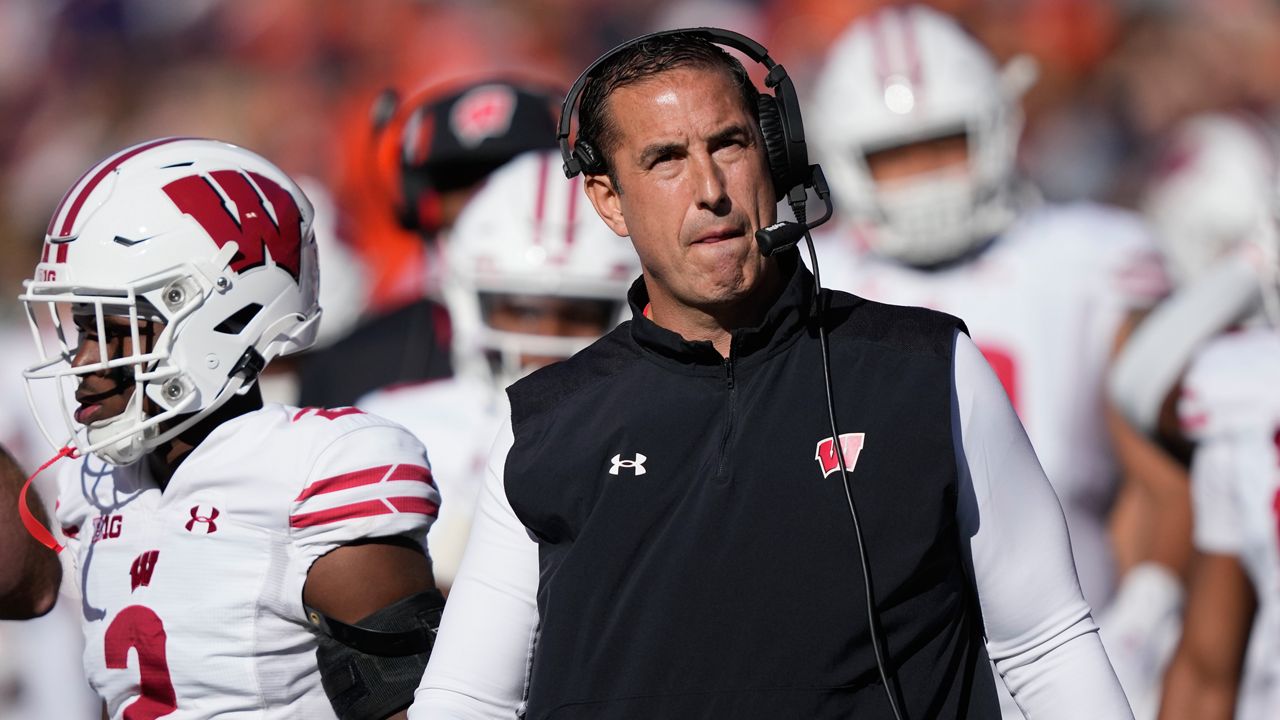 Wisconsin Badgers head coach Luke Fickell looks at the scoreboard during the first half of an NCAA college football game against Illinois