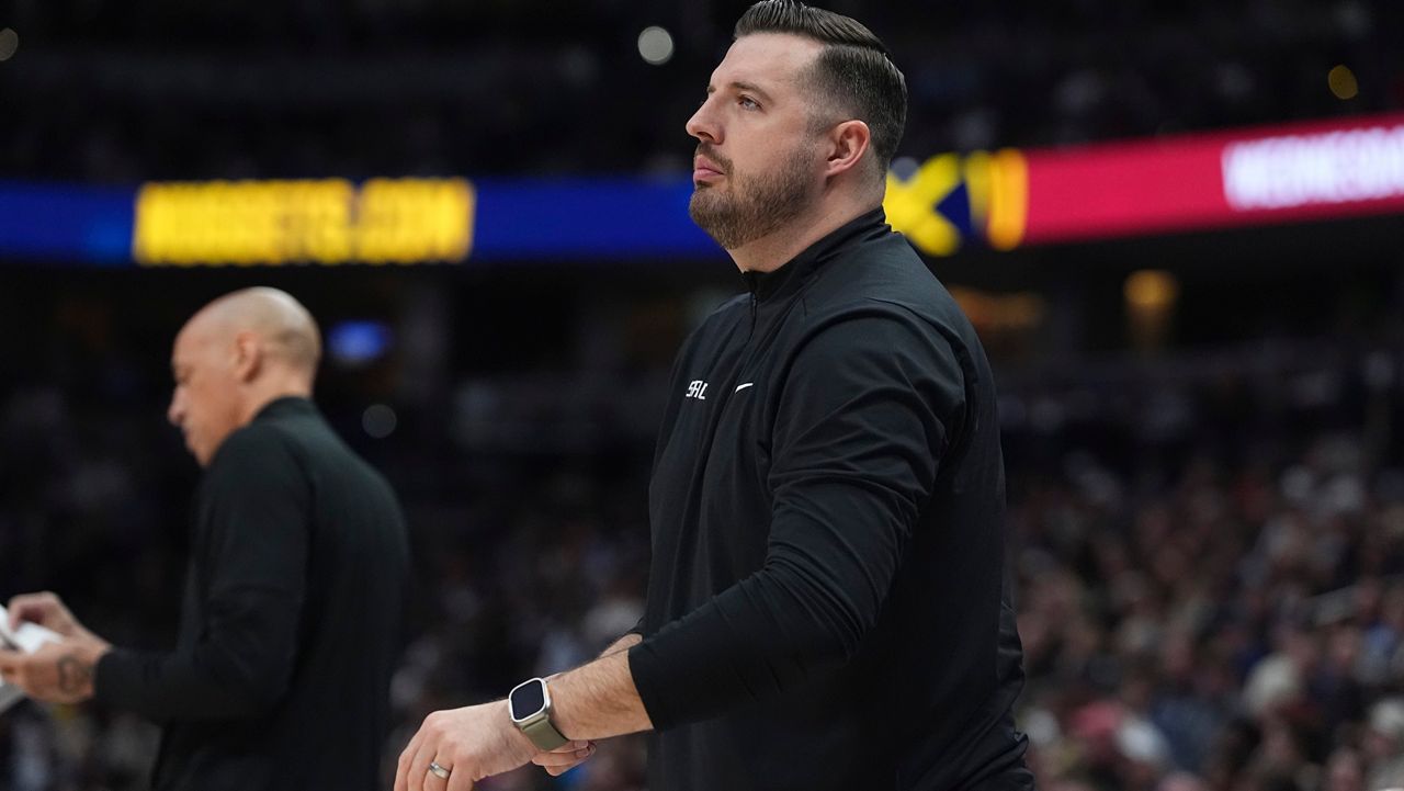 Sacramento Kings assistant coach Luke Loucks in the first half of an NBA basketball gme Wednesday, March 5, 2025, in Denver. (AP Photo/David Zalubowski)