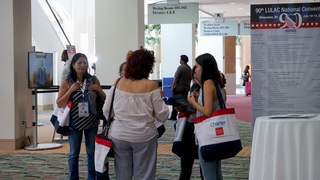 LULAC attendees gather in lobby of convention center.