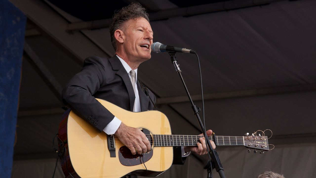 Lyle Lovett and band perform at the New Orleans Jazz and Heritage Festival in New Orleans on Thursday, May 1, 2014. (Photo by Barry Brecheisen/Invision/AP)