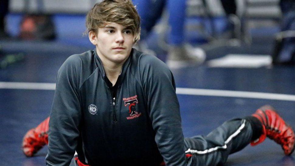 In this Saturday, Feb. 17, 2018 photo, Trinity High School wrestler Mack Beggs warms up before her match at the 6A Region II wrestling meet held at Allen High School in Allen, Texas . Beggs, a senior from Euless Trinity High School near Dallas is transgender and in the process of transitioning from female to male. (Stewart F. House/The Dallas Morning News via AP)