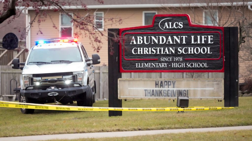 Emergency vehicles are parked outside the Abundant Life Christian School in Madison, Wis., following a shooting, Monday, Dec. 16, 2024. (AP Photo/Morry Gash)