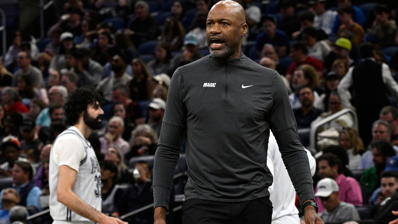 Orlando Magic head coach Jamahl Mosley calls out to an official during the first half of an NBA basketball game against the Toronto Raptors, Tuesday, March 4, 2025, in Orlando, Fla. (AP Photo/Phelan M. Ebenhack)