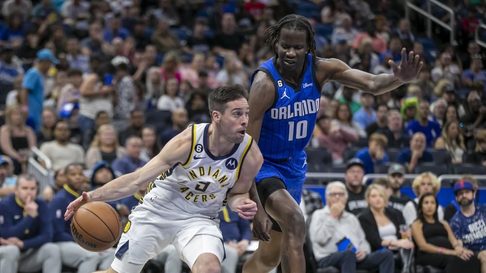 Indiana Pacers guard T.J. McConnell (9) drives against Orlando Magic center Bol Bol (10) during the first half of an NBA basketball game Saturday, Feb. 25, 2023, in Orlando, Fla. (AP Photo/Alan Youngblood)