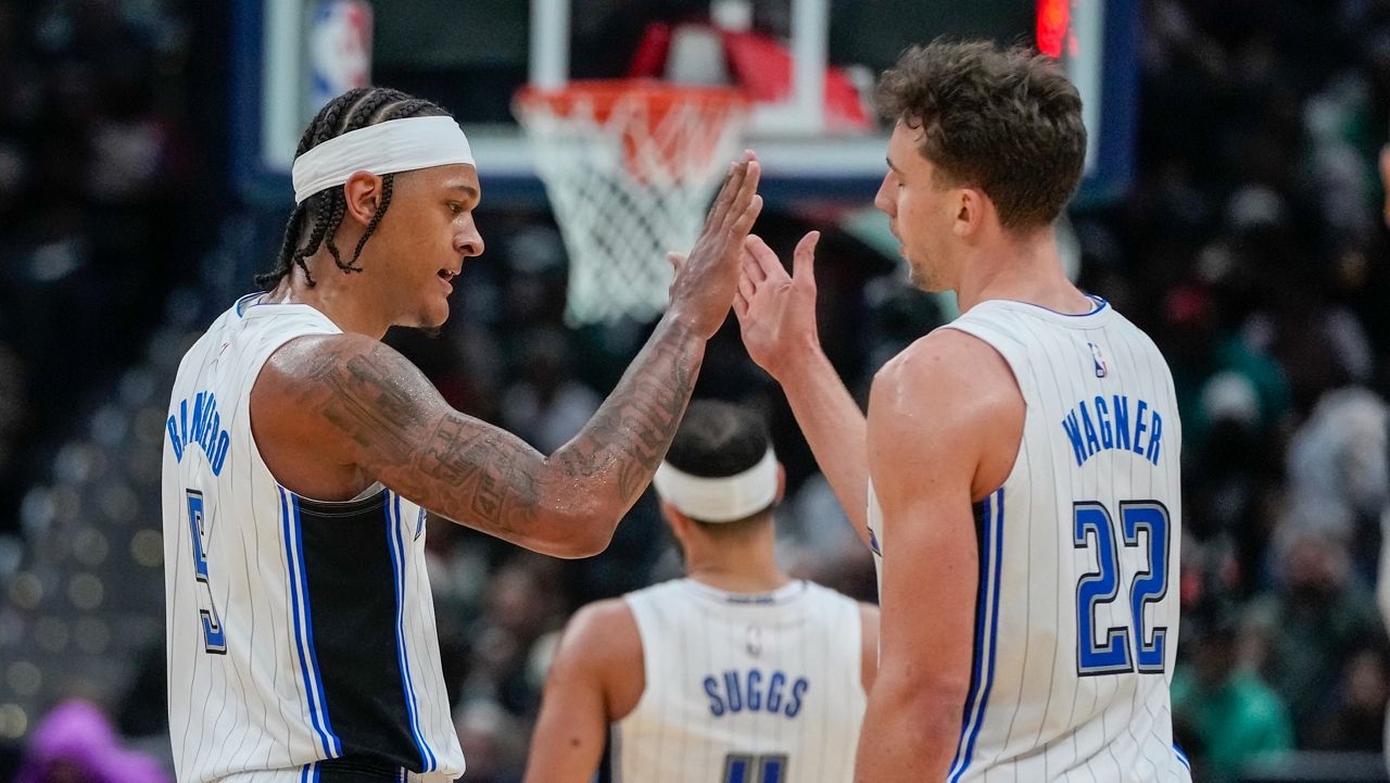 Orlando Magic forwards Paolo Banchero and Franz Wagner (22) celebrate after a play during the second half of an NBA basketball game against the Washington Wizards, Tuesday, Dec. 26, 2023, in Washington. (AP Photo/Alex Brandon)